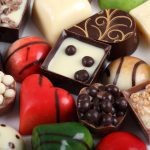 Selection of colorful chocolate candy in heart shape.