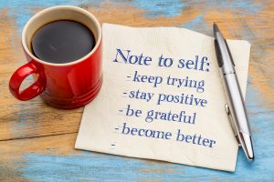 red coffee cup and napkin with words: Note to self: keep trying, stay positive, be grateful, become better