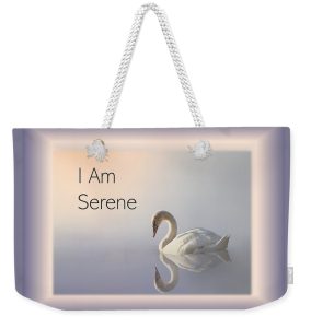 A Weekender tote bag with swan on water and quote, "I am Serene."