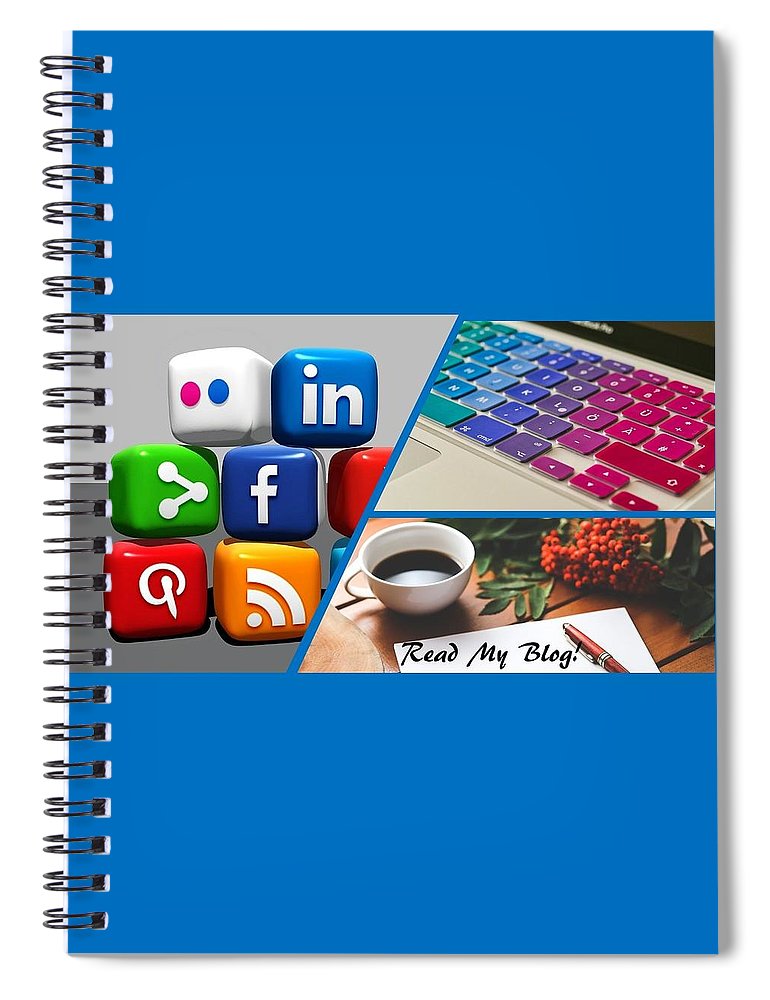 "Read my blog" spiral notebook with social media icons, a keyboard, and coffee cup