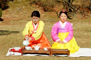 Two Korean women conducting Tea Ceremony by Manseok Kim