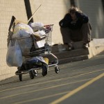 homeless person with shop cart